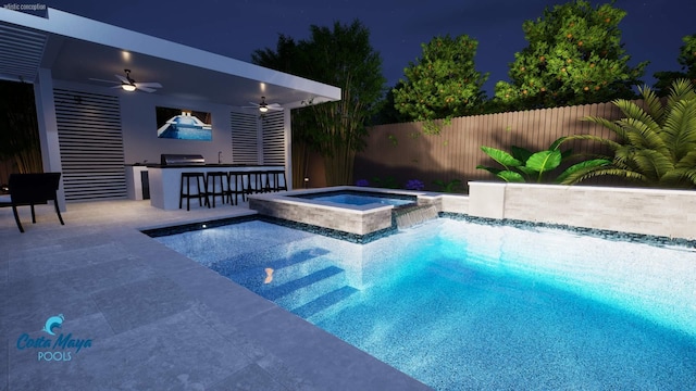 pool at twilight featuring an outdoor kitchen, ceiling fan, an outdoor bar, and an in ground hot tub