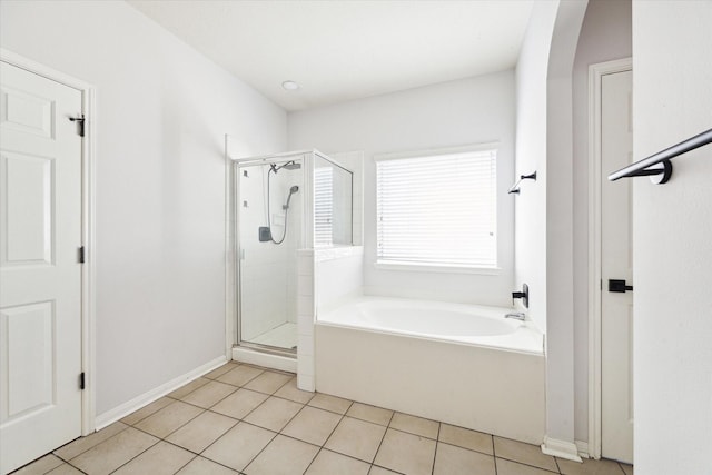 bathroom featuring tile patterned floors and plus walk in shower