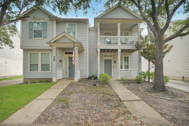 view of front of home featuring a balcony