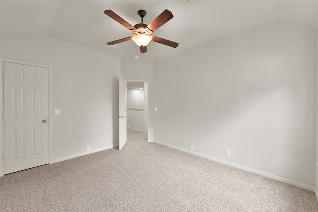 unfurnished bedroom with lofted ceiling, light colored carpet, and ceiling fan