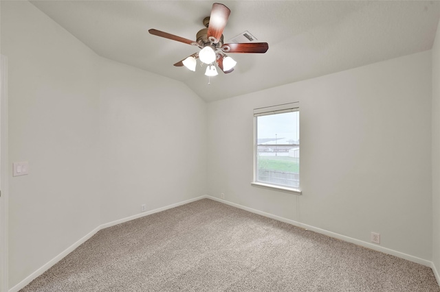 unfurnished room featuring ceiling fan, lofted ceiling, and carpet