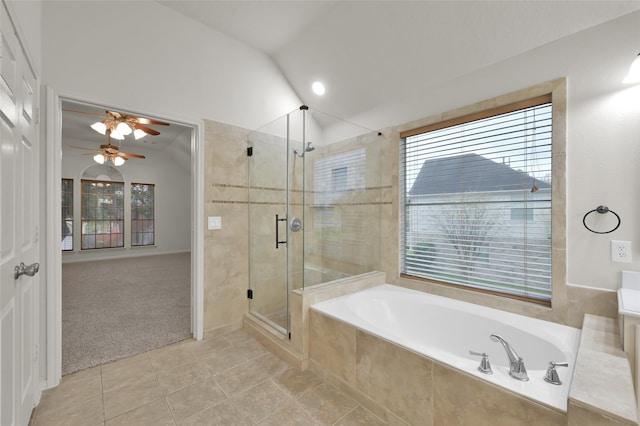 bathroom with lofted ceiling, tile patterned flooring, independent shower and bath, and ceiling fan