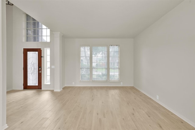 foyer entrance with light hardwood / wood-style flooring