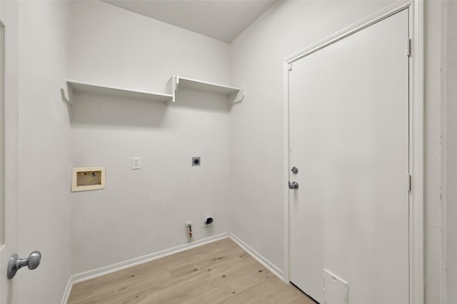 laundry room featuring hookup for a gas dryer, hookup for a washing machine, light hardwood / wood-style flooring, and electric dryer hookup