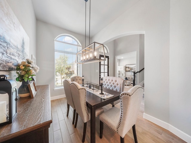 dining area with a chandelier and light hardwood / wood-style floors