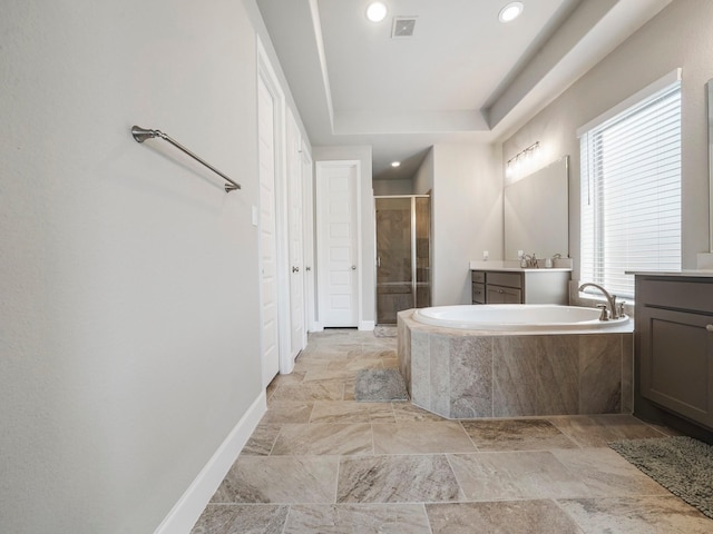 bathroom with vanity and plus walk in shower