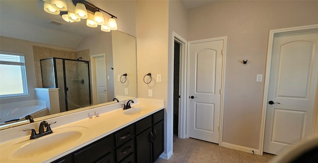 bathroom featuring separate shower and tub, vanity, vaulted ceiling, and tile patterned floors