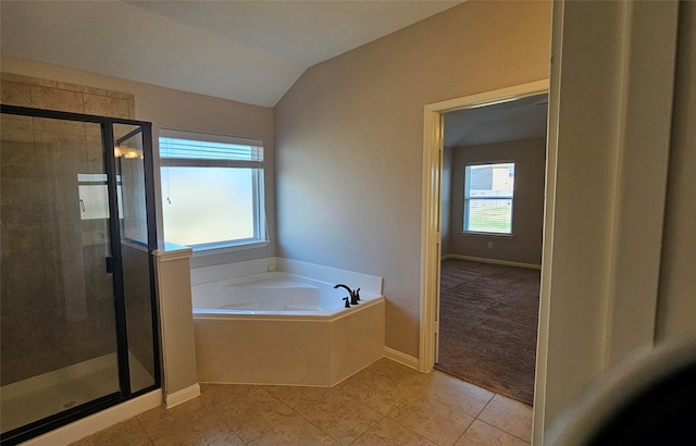 bathroom featuring tile patterned flooring, plus walk in shower, and vaulted ceiling