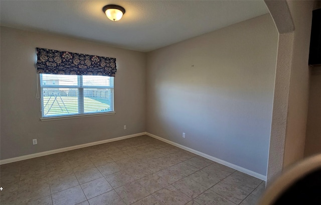 spare room with light tile patterned flooring