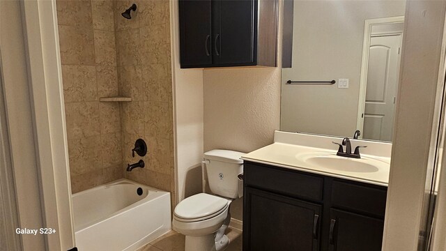 full bathroom with toilet, tile patterned flooring, tiled shower / bath combo, and vanity