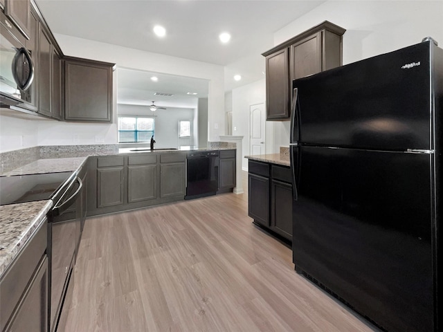 kitchen with ceiling fan, sink, light hardwood / wood-style flooring, dark brown cabinets, and black appliances