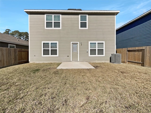 back of house featuring a patio area, a yard, and central AC unit