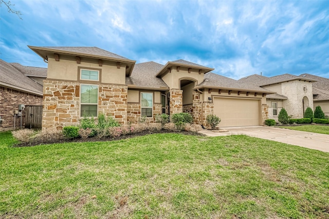 view of front of home with a front yard and a garage