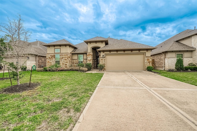 view of front facade with a garage and a front lawn