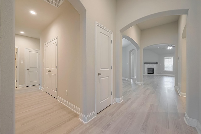 hall with light hardwood / wood-style flooring