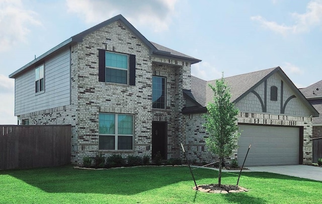 view of front of home with a garage and a front lawn