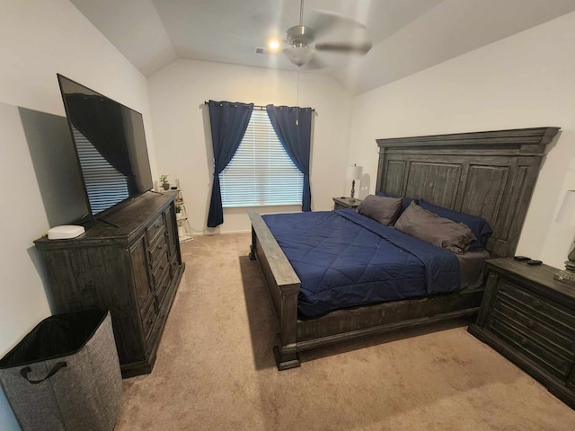 bedroom with ceiling fan, light colored carpet, and lofted ceiling