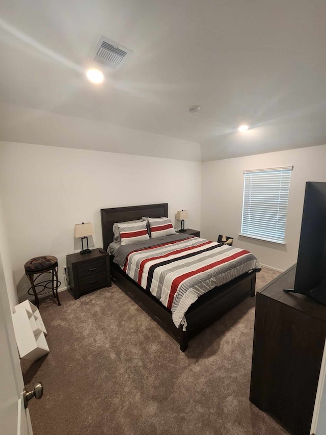 bedroom featuring dark colored carpet