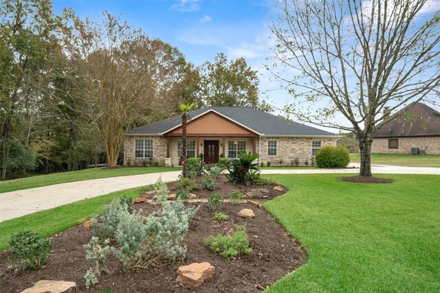 ranch-style home featuring a front lawn