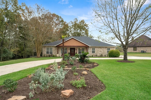 ranch-style house featuring a front lawn