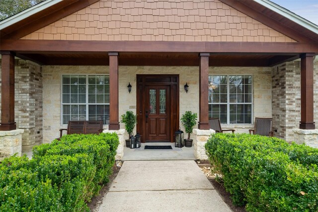 doorway to property featuring a porch