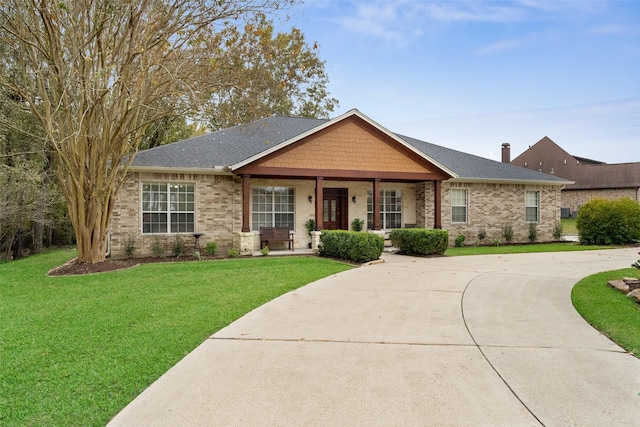 view of front of home with a porch and a front lawn