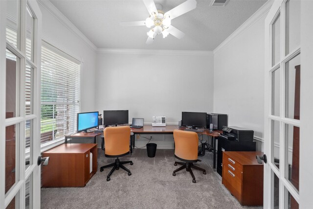 carpeted office space with ceiling fan, french doors, and crown molding