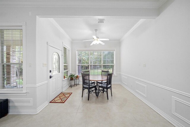 dining space with ornamental molding, light tile patterned flooring, and ceiling fan