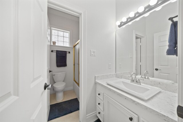 full bathroom featuring toilet, tile patterned floors, shower / bath combination with glass door, and vanity