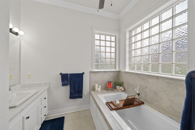 bathroom featuring vanity, a bathing tub, ceiling fan, tile patterned floors, and ornamental molding