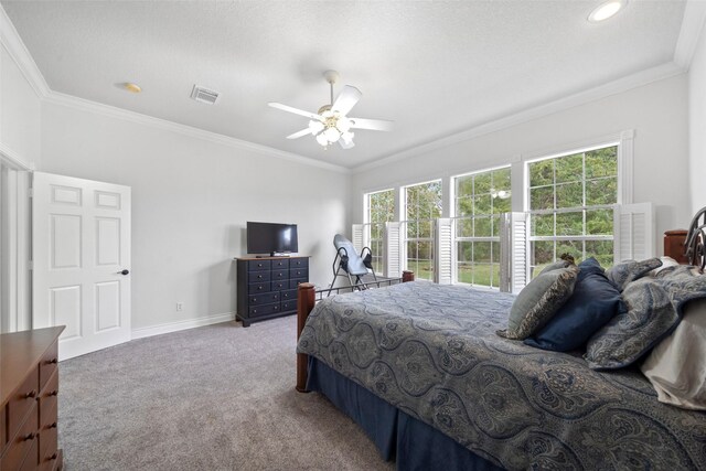 bedroom with multiple windows, crown molding, and carpet flooring