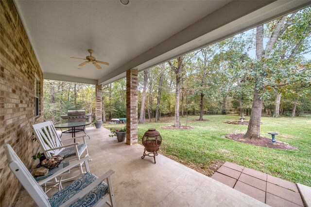 view of patio / terrace with area for grilling and ceiling fan