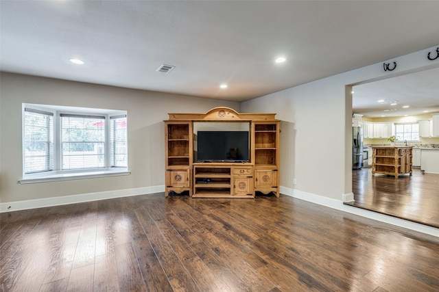 living room with dark hardwood / wood-style floors