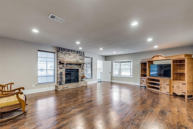 living room with a fireplace and dark hardwood / wood-style floors