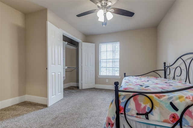 carpeted bedroom featuring ceiling fan and a closet