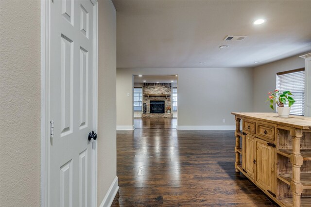 corridor with dark hardwood / wood-style flooring