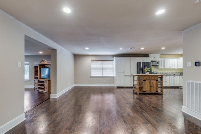 living room with dark hardwood / wood-style flooring