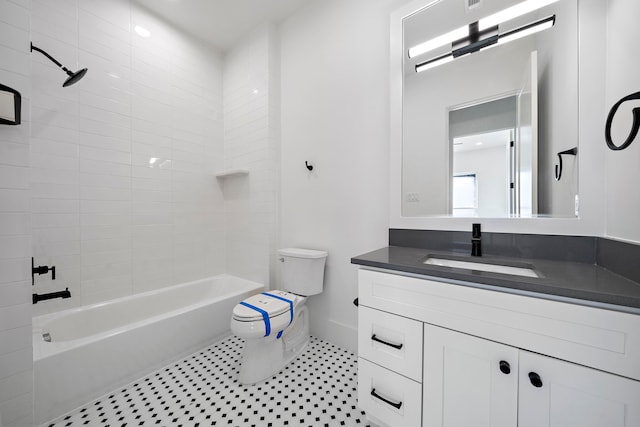 full bathroom with vanity, toilet, and tiled shower / bath