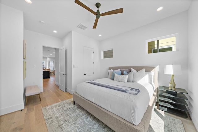 bedroom featuring ceiling fan and light hardwood / wood-style floors