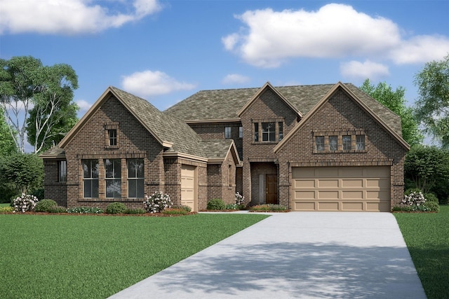 view of front of home featuring a front yard and a garage