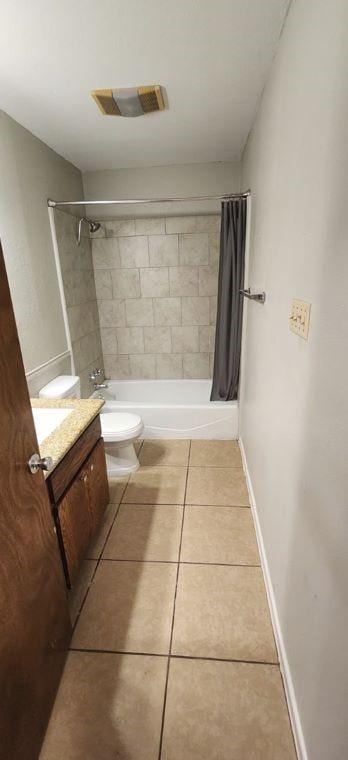 full bathroom featuring tile patterned flooring, vanity, shower / bath combination with curtain, and toilet