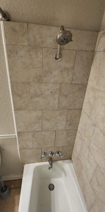 bathroom featuring separate shower and tub