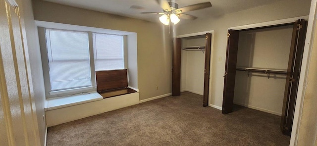 unfurnished bedroom featuring ceiling fan and dark colored carpet