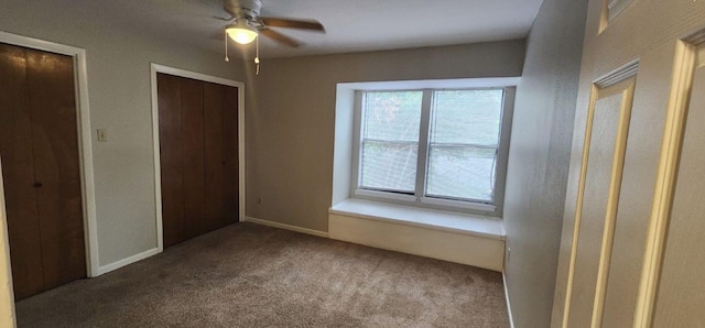 unfurnished bedroom featuring carpet flooring and ceiling fan