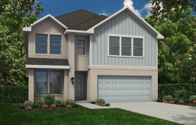 view of front of home featuring a front yard and a garage