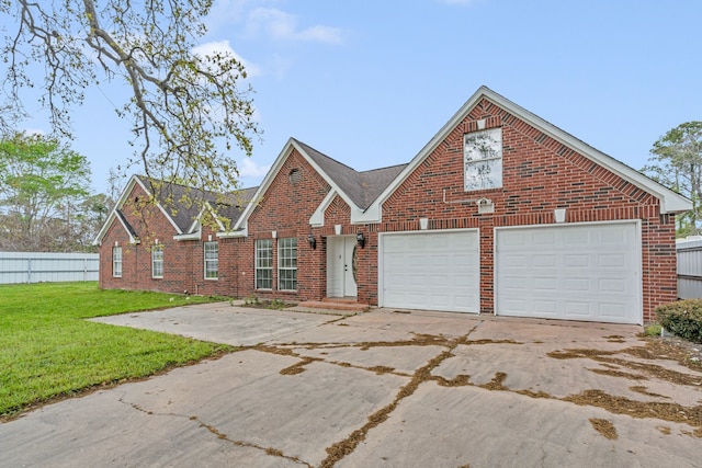 view of front facade featuring a garage and a front lawn