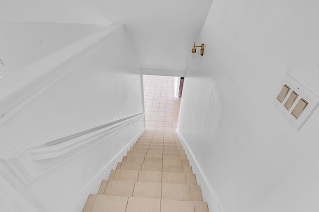 stairs with tile patterned floors