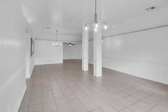 interior space with light tile patterned floors, ceiling fan with notable chandelier, and ornamental molding