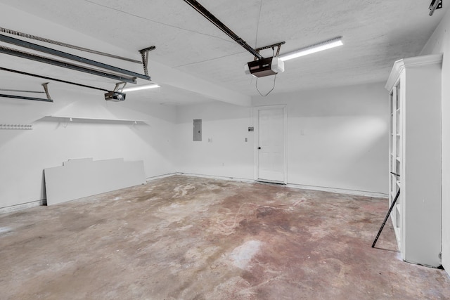 garage featuring electric panel and a garage door opener