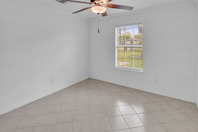 spare room with ceiling fan, light tile patterned floors, and crown molding